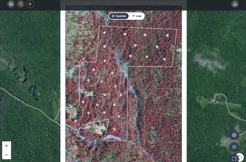 A property map imported from a georeferenced PDF, with its boundary and numbered plots, lined up over the satellite map with Custom selected